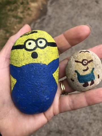 two stones painted with Minions characters