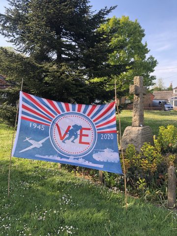 VE Day flag by war memorial