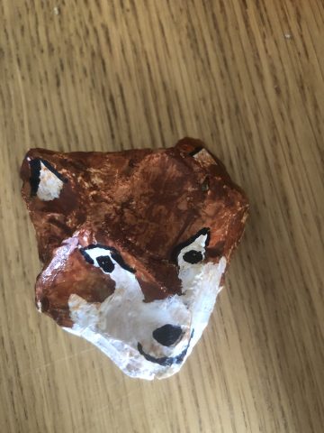 rock painted as a fox