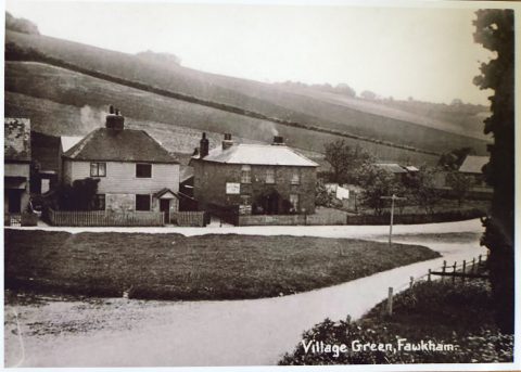 old postcard showing village green and houses