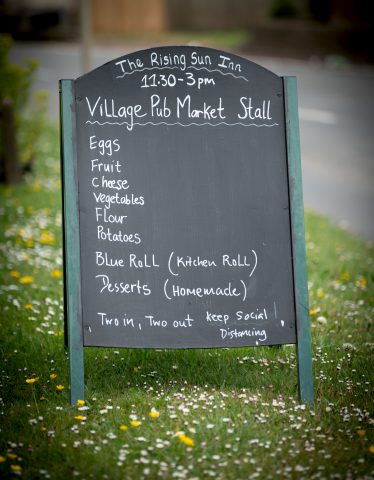photo of chalkboard with shop details